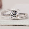 Solitaire engagement ring with round diamond.
