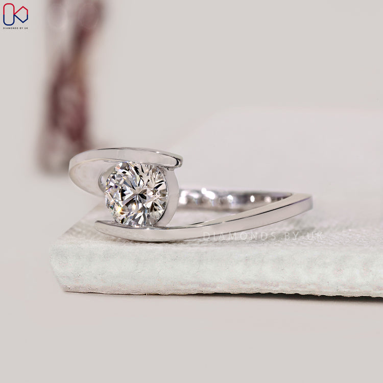 Bypass setting round solitaire engagement ring.
