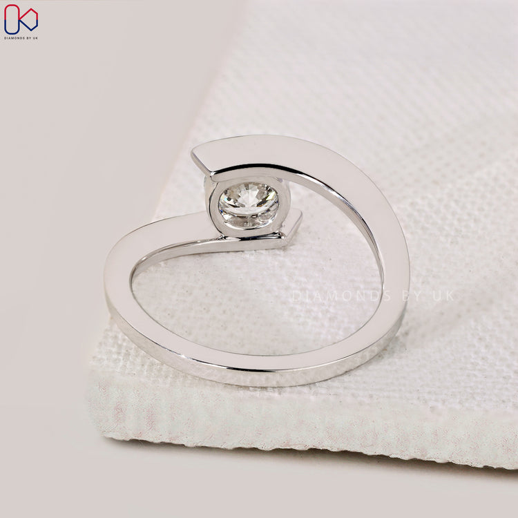 Lab grown round diamond solitaire engagement ring.
