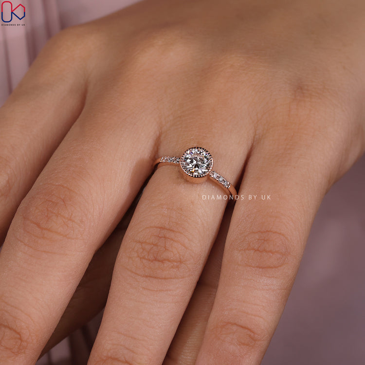 Diamondsbyuk engagement ring with pave detailing.

