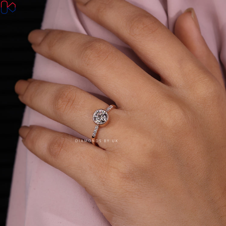 Rose gold diamond ring with a unique design.
