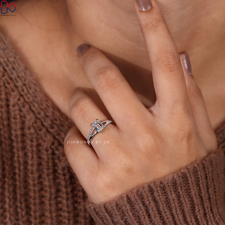 Engagement ring with side accents and claw setting.
