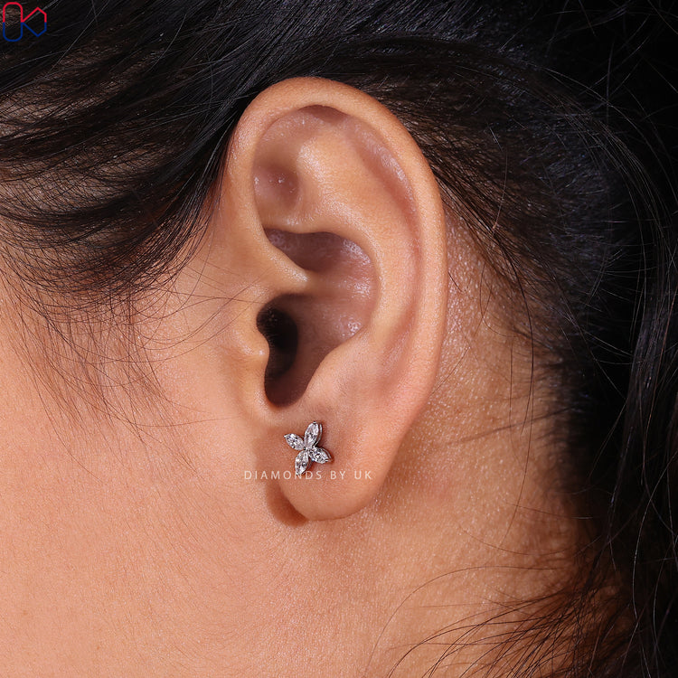 Handmade earrings with white gold and prong set diamonds.
