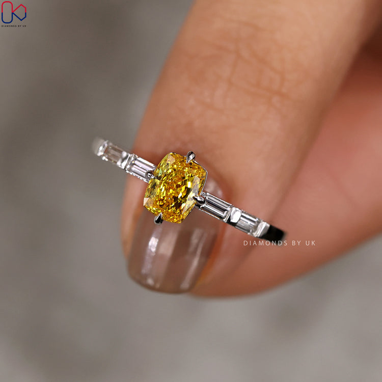 Diamondsbyuk engagement ring with baguette side stones.