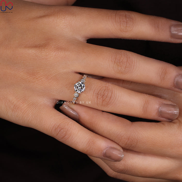 Diamondsbyuk engagement ring showcasing a round diamond.
