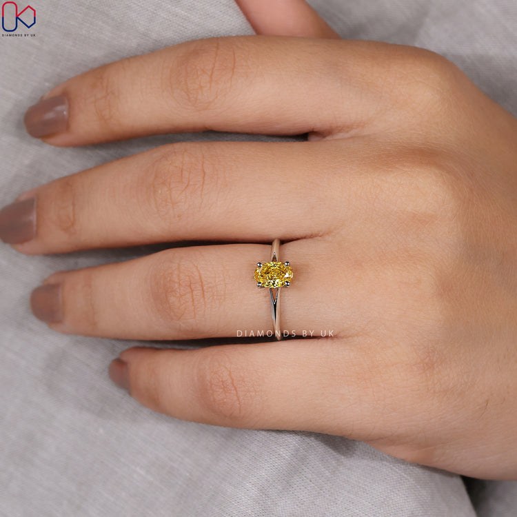 Diamondsbyuk engagement ring set with a canary yellow diamond.
