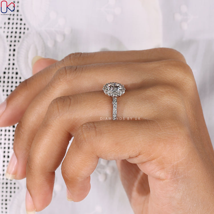 Handmade ring crafted with a round diamond in pave setting.
