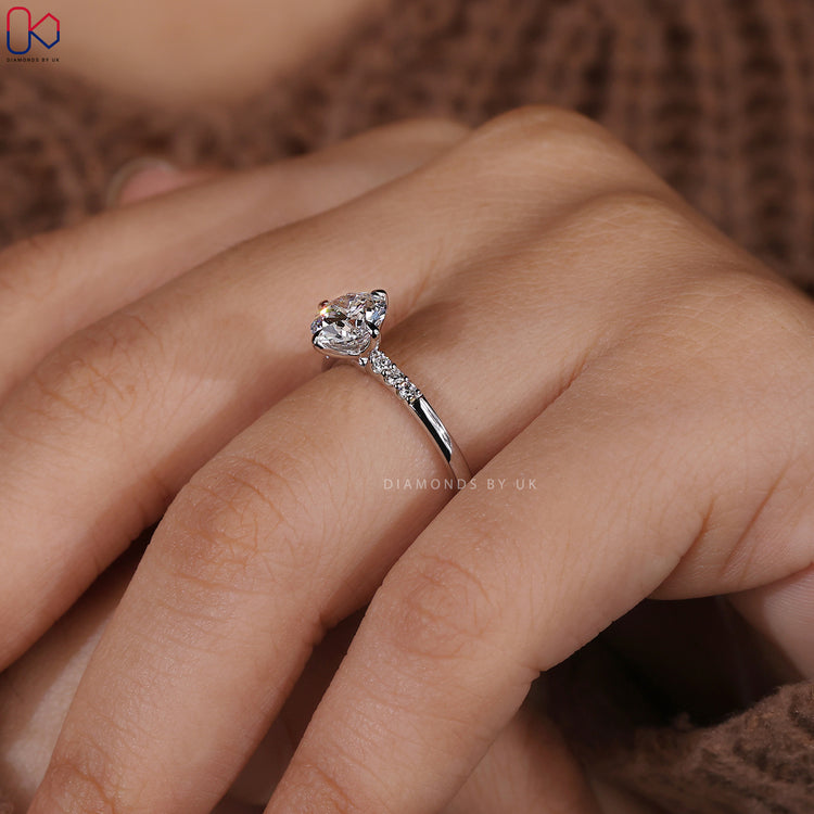 Handmade white gold side Stone setting engagement ring.
