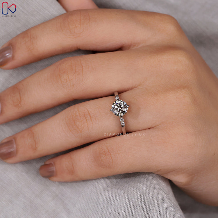 Handmade four claw Round diamond ring.
