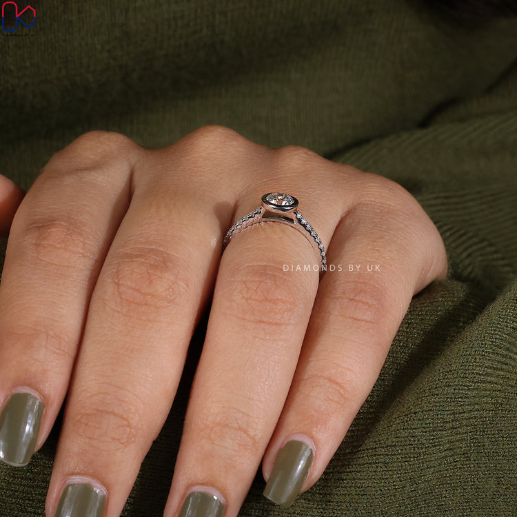 Handmade jewellery, bezel round diamond ring in white gold.
