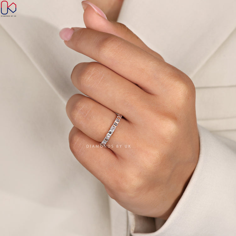 Handmade wedding band in rose gold with mixed cuts.
