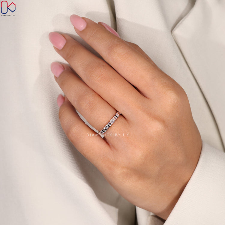 Handmade eternity band with baguette and princess cuts.
