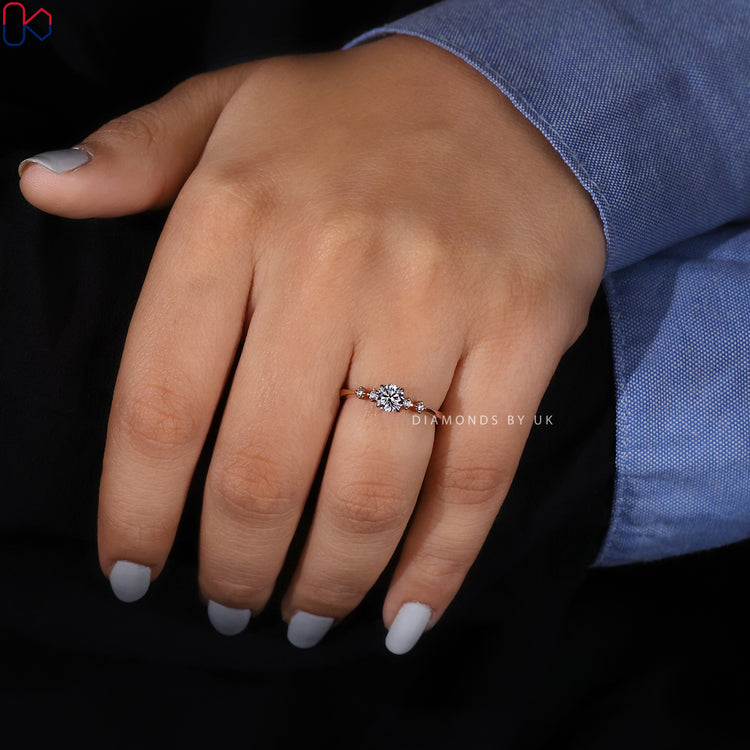 4 claw prong five stone ring with tapered shank design.
