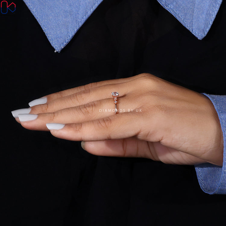 Custom round cut diamond ring with claw prongs.
