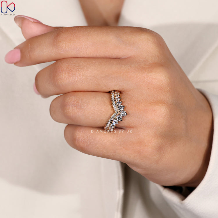 Prong set wedding band in a half eternity layout with custom features.
