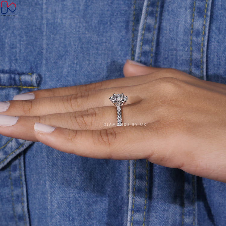 White gold diamond ring with a sleek modern design.
