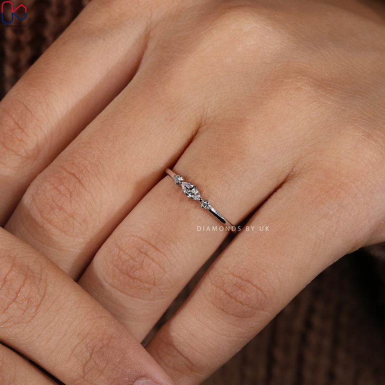 Customise wedding band in round cut with prong set diamonds.
