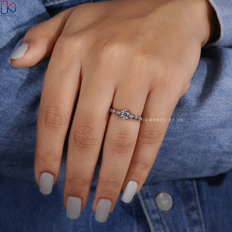 Handmade white gold ring featuring round diamond.
