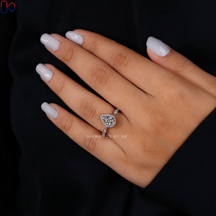 Customize ring with claw prong setting and halo design.
