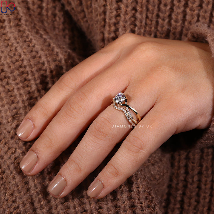 Stackable wedding band with a delicate round cut diamond design.
