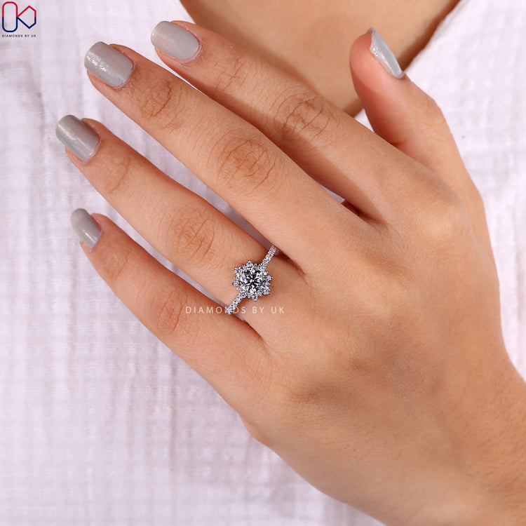 Halo diamond ring featuring a brilliant centre stone and halo.

