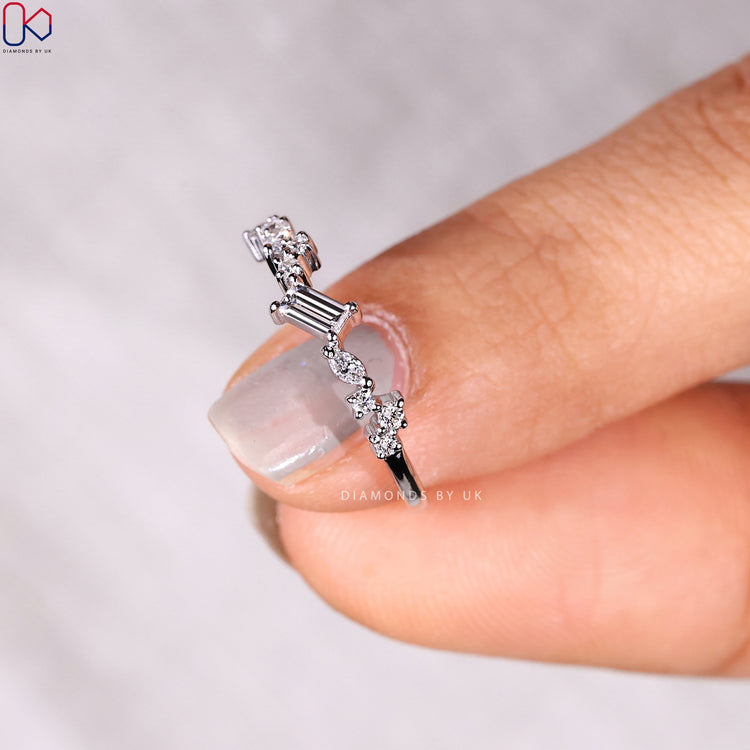 Baguette diamond band and prong setting band styled together.
