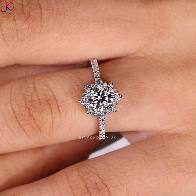 Diamondsbyuk engagement ring with pave setting and round diamond centre.
