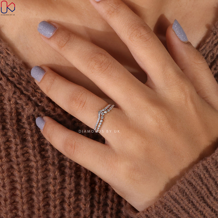 White gold diamond band set with prong set wedding band structure.
