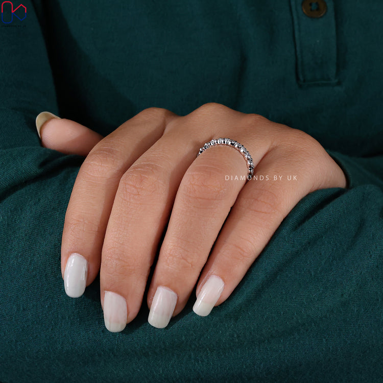 A Lab Grown Diamond white gold wedding band with a contemporary shared prong design.

