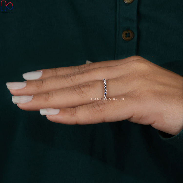 Handmade jewelry featuring a stunning round diamond wedding band.
