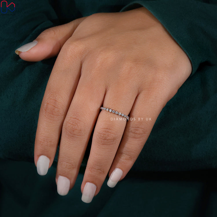 Lab grown diamond round eternity band perfect for eco-conscious couples.