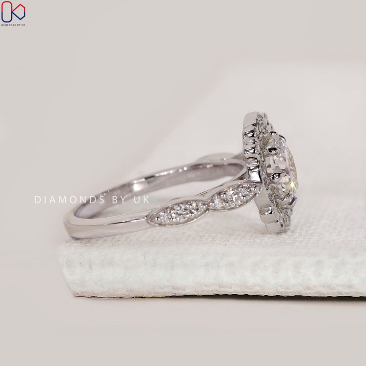 Art deco diamond ring with round centre stone and vintage band.
