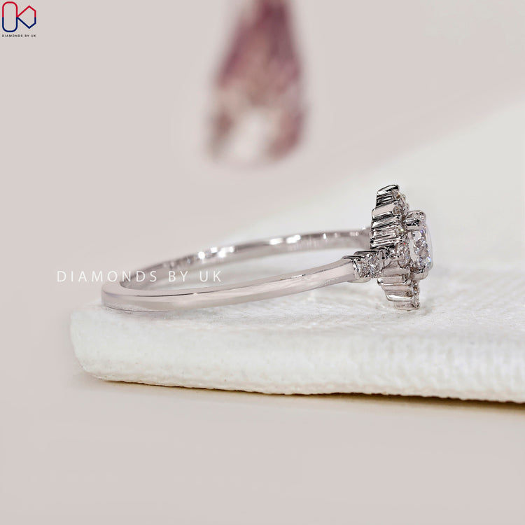 Diamondsbyuk round diamond engagement ring with prong setting.
