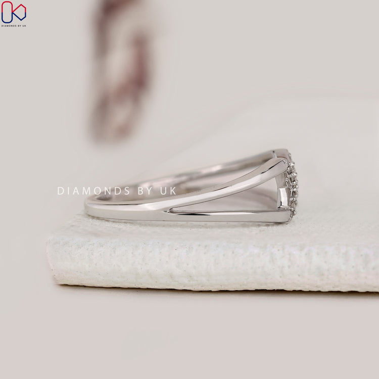 White gold engagement ring with open cuff band.
