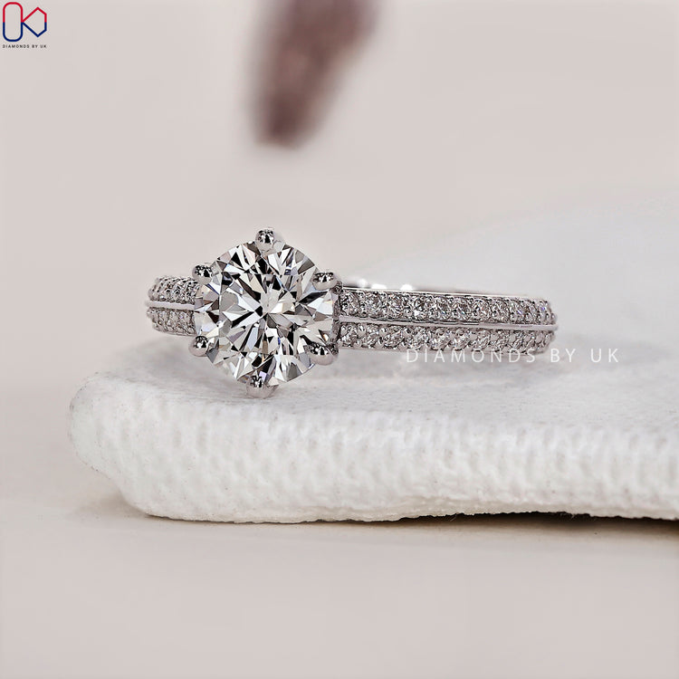 Engagement ring UK with a classic round cut diamond ring in a secure setting.