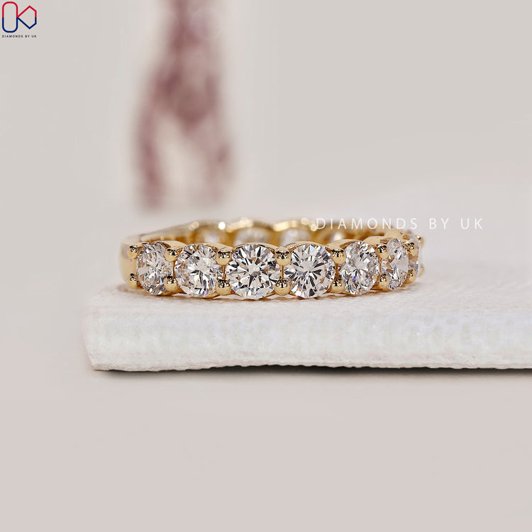 Yellow gold engagement band with sparkling lab grown diamonds.
