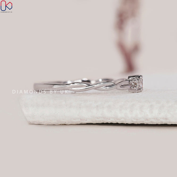 Lab Grown Diamond 3 stone round ring with twist shank.
