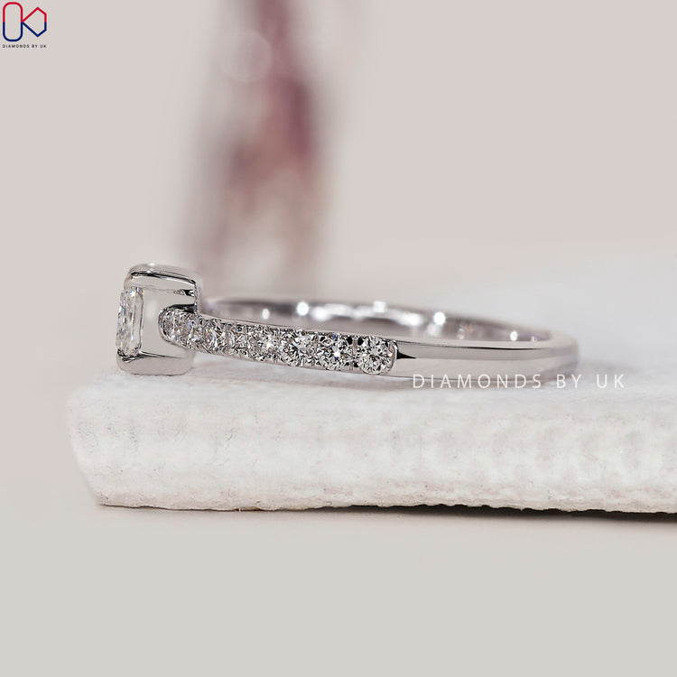 Handmade jewellery featuring a radiant cut diamond and white gold.
