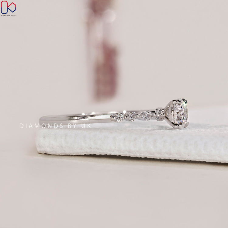 Handmade ring featuring a round cut diamond ring in a white gold engagement ring setting.

