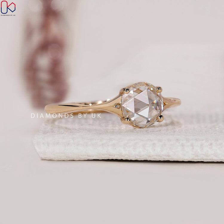 4 prong setting built to support the flat base of a rose cut diamond.