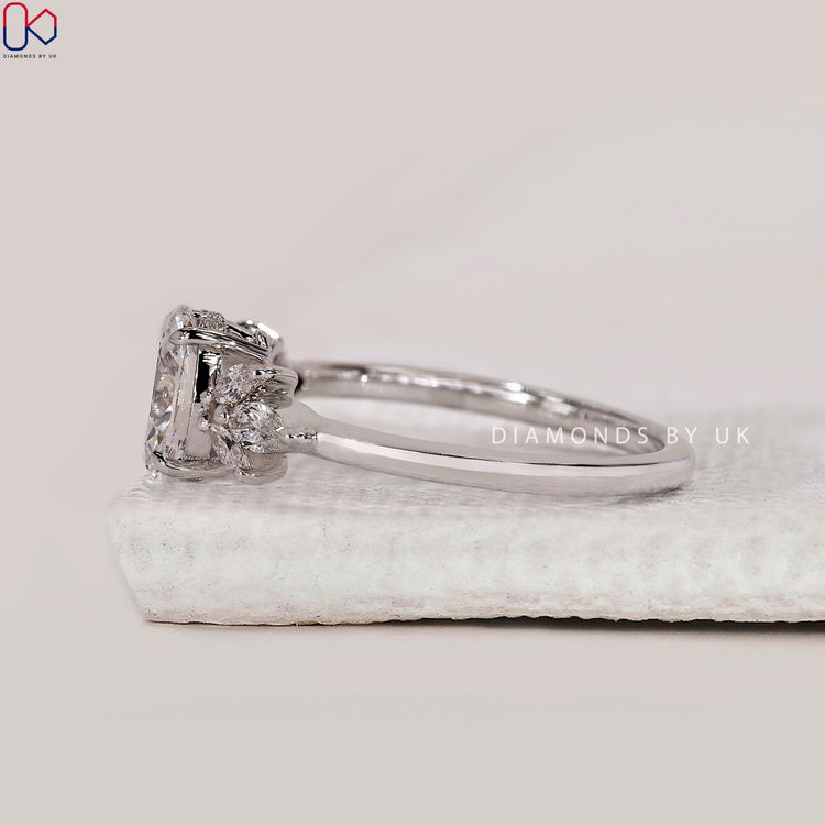 7 stone engagement ring with oval and marquise diamonds.
