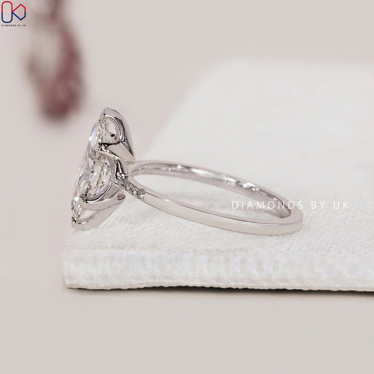 V Prong Setting Marquise Diamond Engagement Ring with round side diamonds, set in white gold for an exquisite design.
