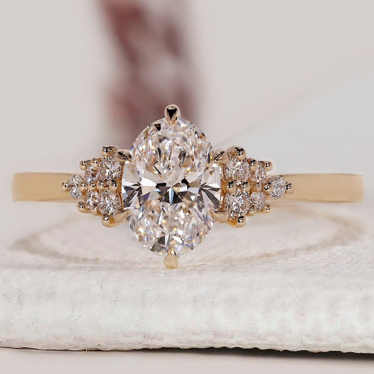 Oval shaped engagement ring with muse setting.
