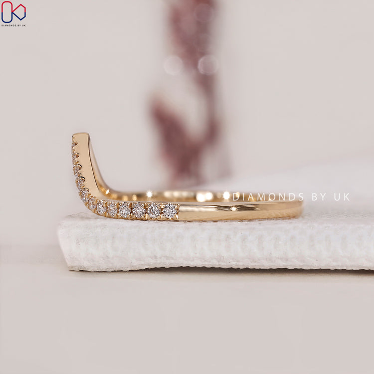 Curved Diamond Wedding Band with a sleek and elegant design.
