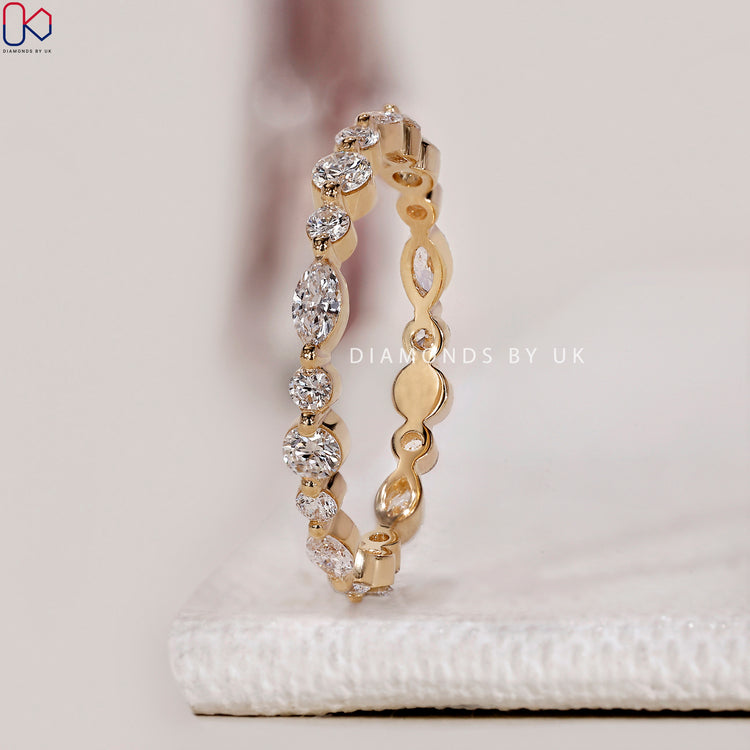 Shared prong diamond band ensuring secure placement and maximum sparkle.
