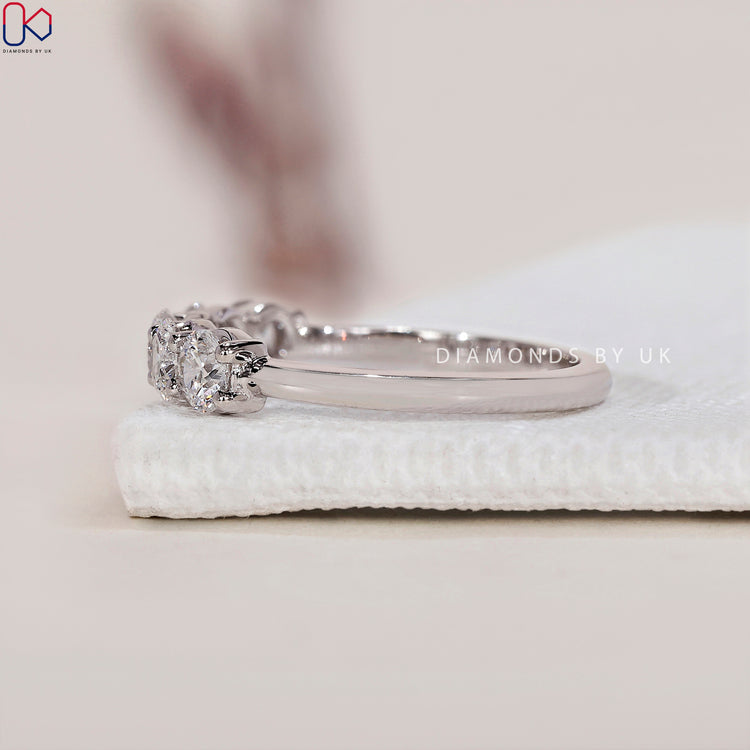 Shared prong wedding band showcasing sparkling diamonds in a classic style.
