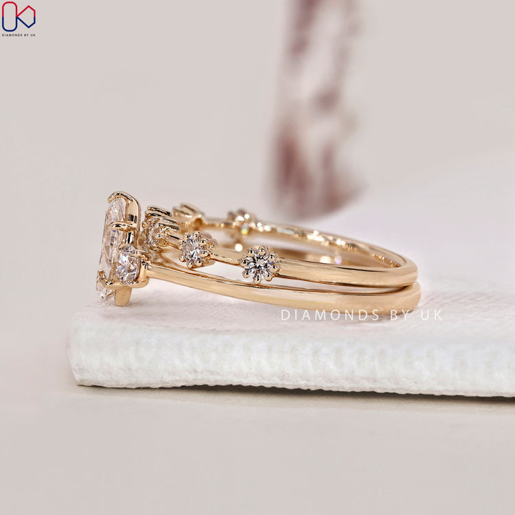 Distance pave wedding band with a beautiful pear cut diamond.

