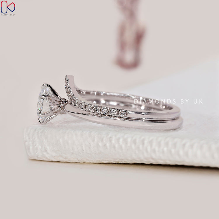 Half eternity wedding band with round diamond wedding band in white gold.
