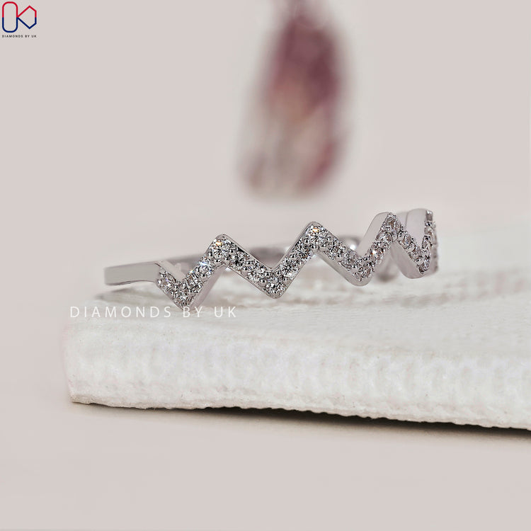 White gold diamond band with shimmering lab grown stones.
