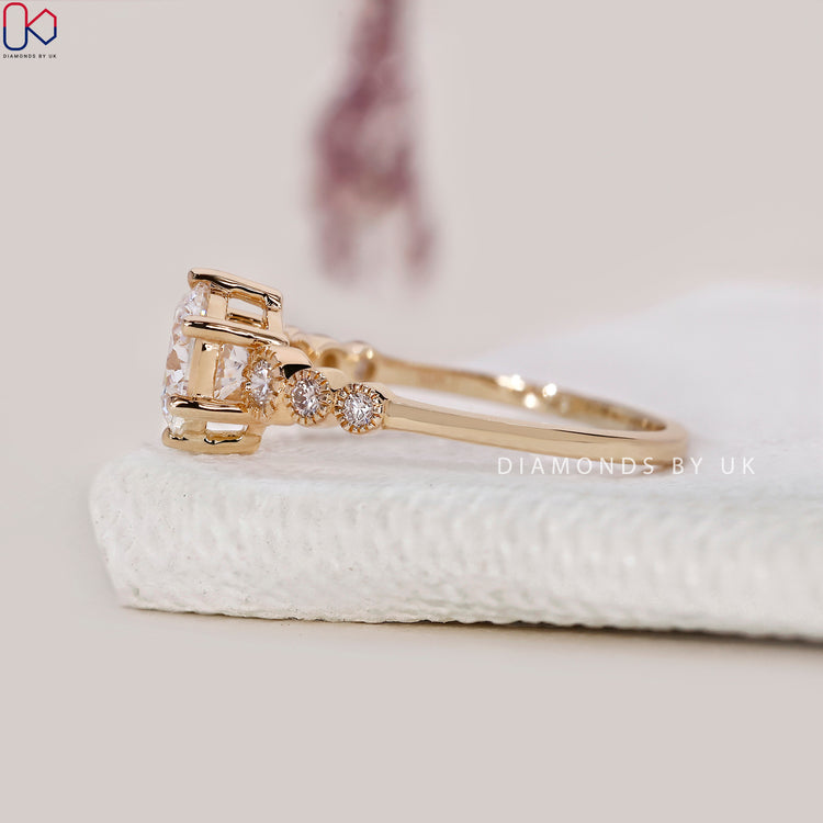 Handmade ring featuring a round diamond and milgrain detail.
